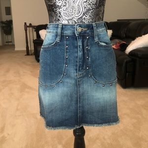 A studded jean skirt.